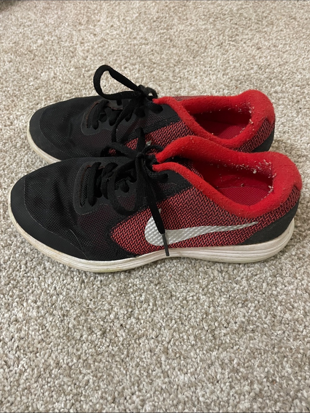Nike Kids Black and Red Athletic Sneaker with White Swoosh